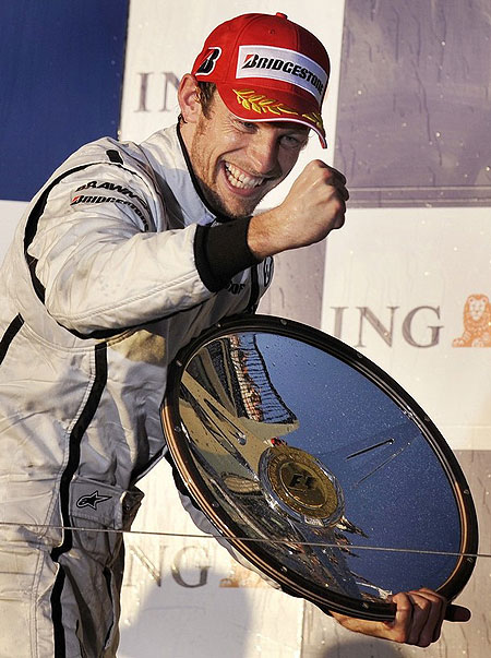 Brawn driver Jenson Button of Great Britain celebrates on the podium after winning Formula One's Australian Grand Prix in Melbourne on March 29, 2009